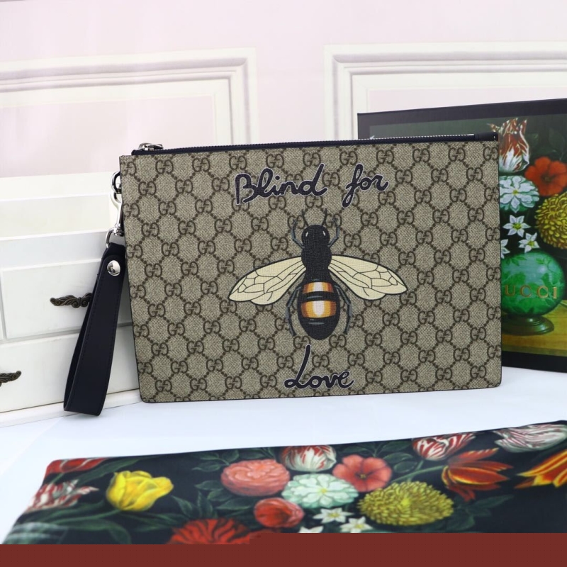 G*u*i clutch bags